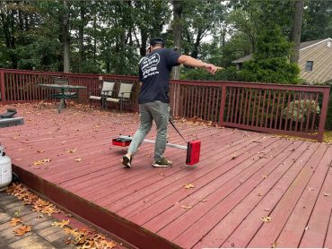Oil Tank Scan NJ technician sweeping a deck area with detection equipment
